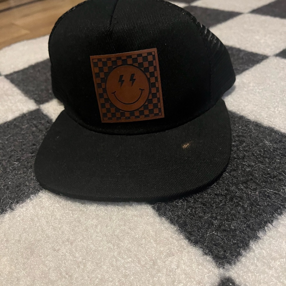 Hat with leather lightning bolt patch